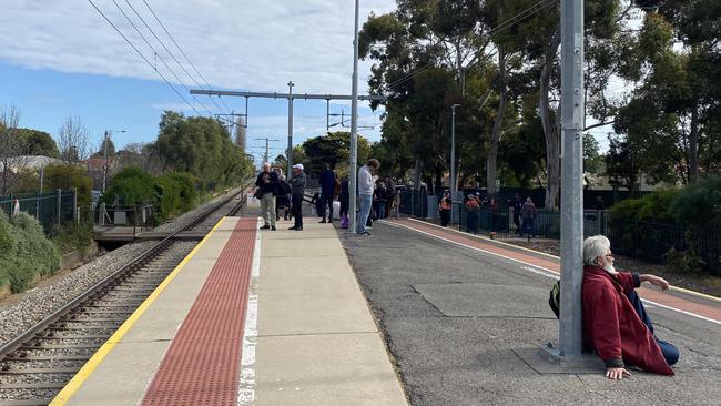 Passengers waiting for new transport to arrive.