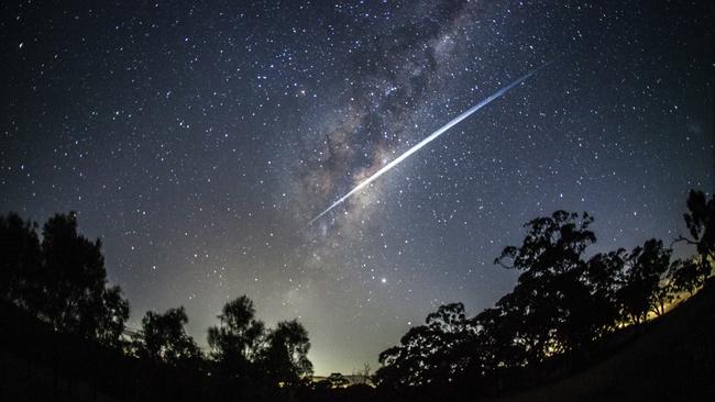 About 40 of Elon Musk's Starlink satellites streaking through the night sky over Lethbridge in western Sydney. Picture: Rodd Westwood