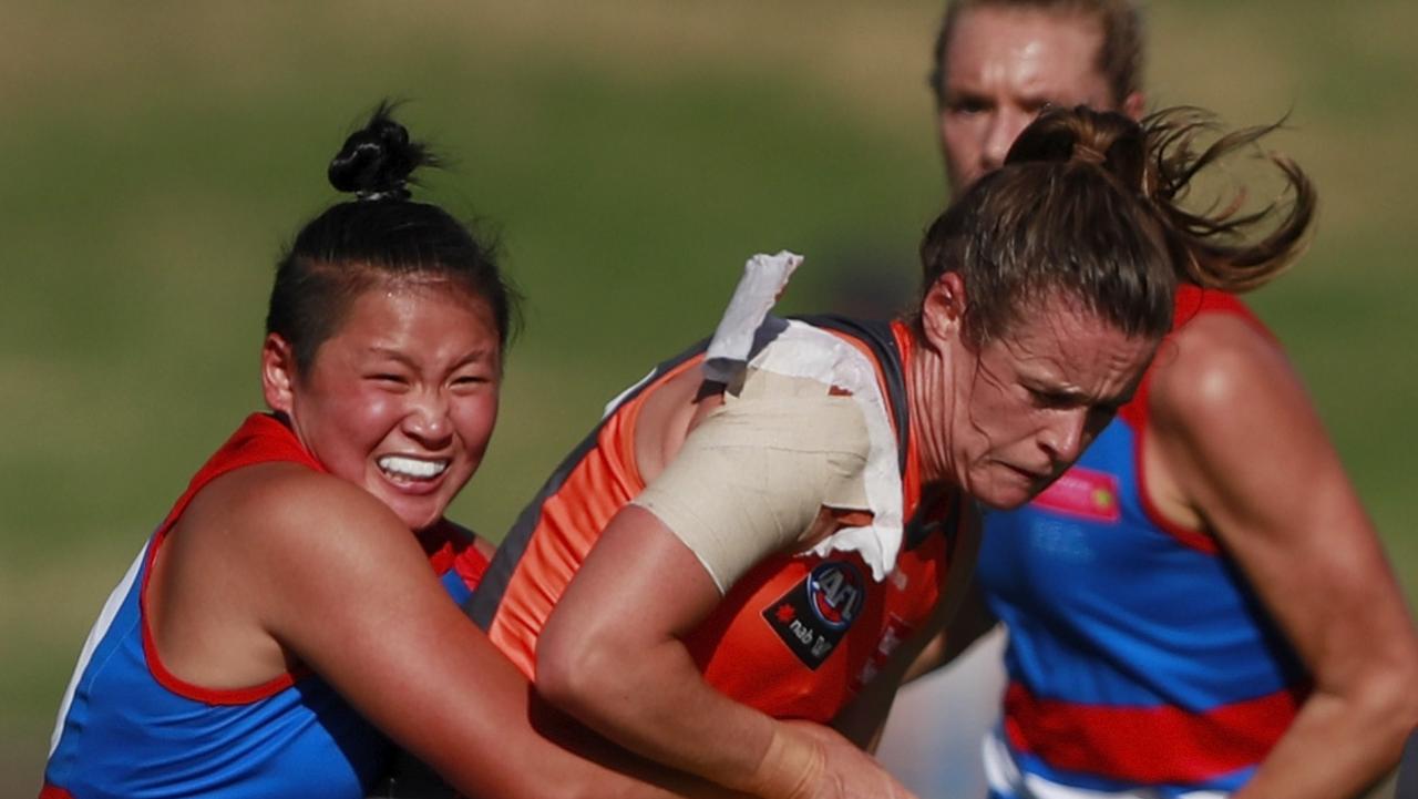 Giants gun Alicia Eva tackled by Amanda Ling of the Bulldogs during the 2022 AFLW round four match.