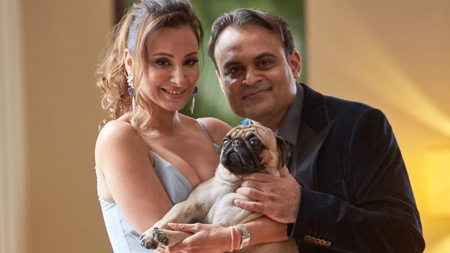 Pankaj and Radhika Oswal and family dog Coco. <i>Picture: Louis Kwok for The Australian</i>