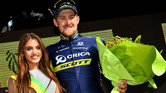 Australia's Luke Durbridge (R) of Orica Scott celebrates poses on the podium after winning part two of the third and last stage of the Driedaagse De Panne — Koksijde cycling race, a 14,2km individual time trial from and to De Panne on March 30, 2017. / AFP PHOTO / Belga / DAVID STOCKMAN / Belgium OUT