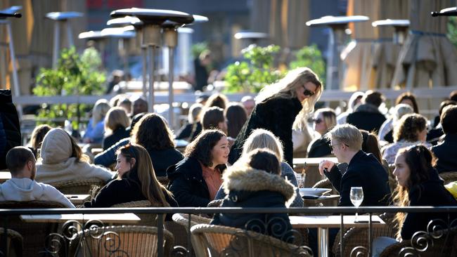 Stockholmers enjoy the sun at a terrace on a square in central Stockholm amid the novel coronavirus pandemic. Picture: Janerik Henriksson/AFP