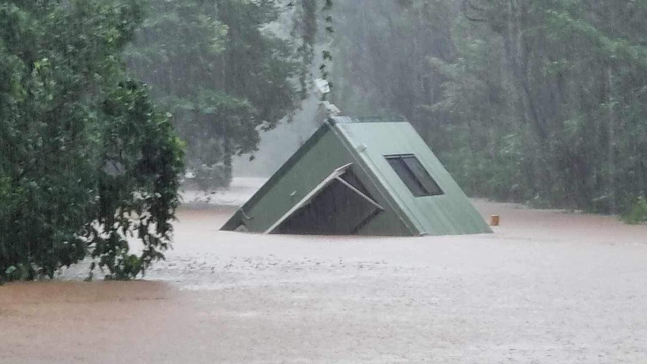 Cairns floods 2023: The toll booth at Daintree ferry washes away. Picture: Charmaine Norris