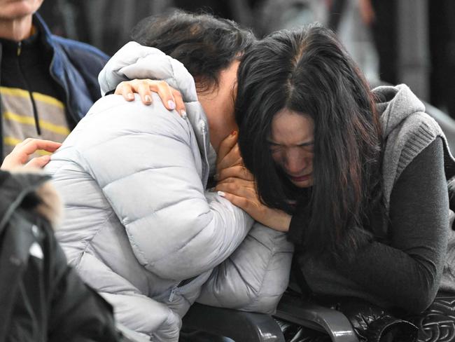 Relatives of passengers of a Jeju Air Boeing 737-800 series aircraft react near a make-shift shelter at Muan International Airport in Muan. Picture: AFP