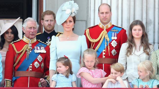 Meghan, then Prince Charles, Prince Harry, Catherine, Prince William, Princess Charlotte, Savannah Phillips, Prince Georg ewatch the fly-past on the balcony of Buckingham Palace during Trooping The Colour in 2018. Picture: Getty Images.