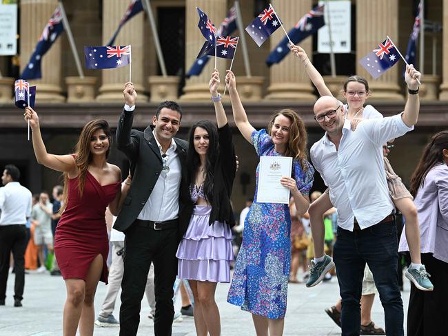 26/1/2024:  new citizens, (L-R) Priya Jain 30, Andrea Abate 32 and partner Chiara Trotta 26, Aines Peoples 23, Andy Hall 43 and daughter Sophie 9,  after the large Australia Day citizenship ceremony at the Brisbane Town Hall. 550 people were sworn in as Australian citizens during the ceremony.  pic: Lyndon Mechielsen/The Australian