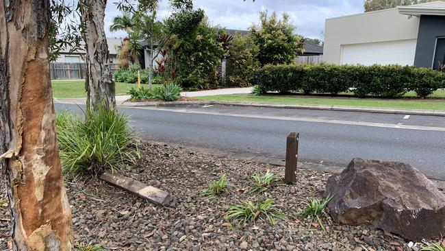 Street posts were knocked out and a tree left damaged after a ute crashed in Woodgrove Boulevard in Beerwah. Picture: Aisling Brennan