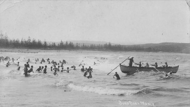 Members of the Sly family in Manly Council's surfboat at Manly. Picture Northern Beaches Library