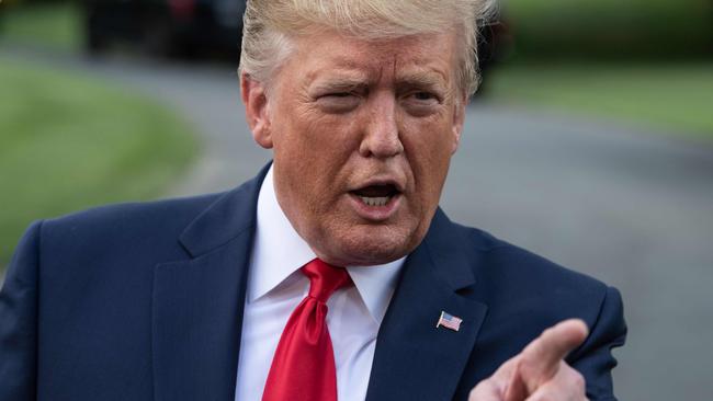 Donald Trump talks to journalists after his latest trade move. Picture: AFP