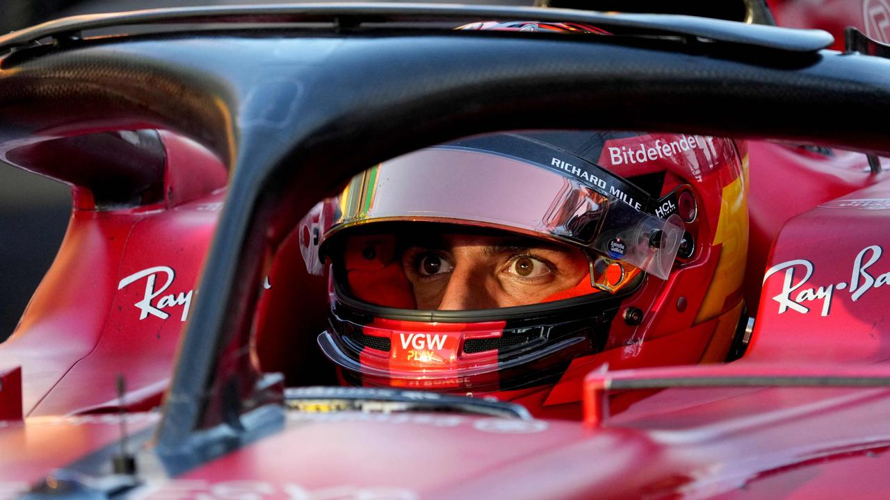 Carlos Sainz questioning his life choices are bumping into Fernando Alonso. (Photo by Simon Baker / POOL / AFP)