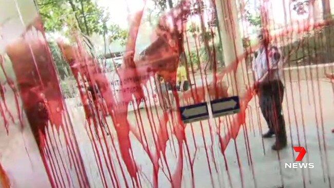 Refugee protesters have thrown red paint during the PM’s visit to the University of Queensland. Picture: 7NEWS