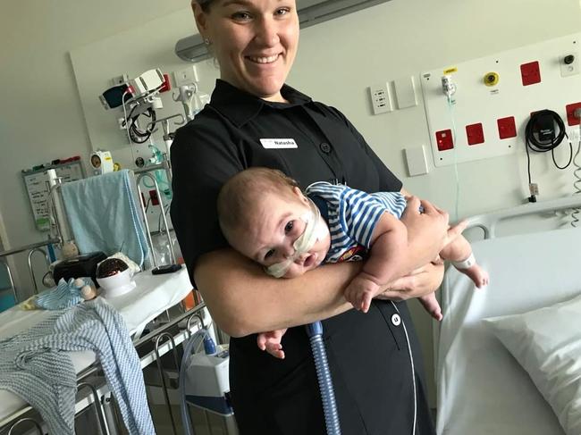 Archie du Preez, 5 months old, with nurse Natasha Zajaz in Ward 9B at the Queensland Children's Hospital. Archie passed away in 2019 from a combination of Neonatal Chronic Lung Disease and a rare Interstitial Lung Disease with Alveolar Growth Abnormalities. Picture: Supplied<br/>