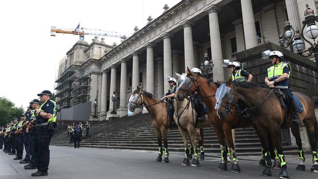 Police outside Parliament House for the Invasion Day rally. Picture: Nicole Garmston