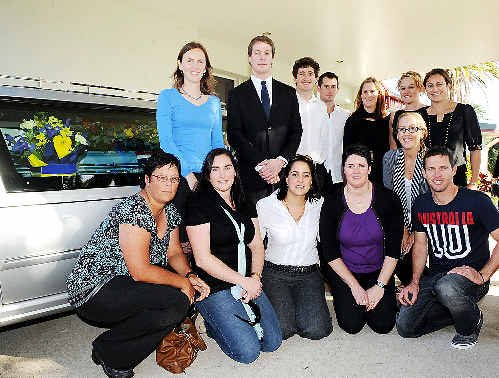 Honouring former coach Stan Tilley at yesterday’s funeral service are swimmers (rear, from left) Heather Batton, Jonathon Newton, Matthew Thompson, Trevor Trembath, Amelia Thompson, Hannah Mitchell and Hannah Gibson; and (front, from left) Dyana (Calub) Brown, Anita (Conte) Ghilardi, Laurel Moston, Petria Thomas, Alison Kiddle and Troy White. Jacklyn Wagner