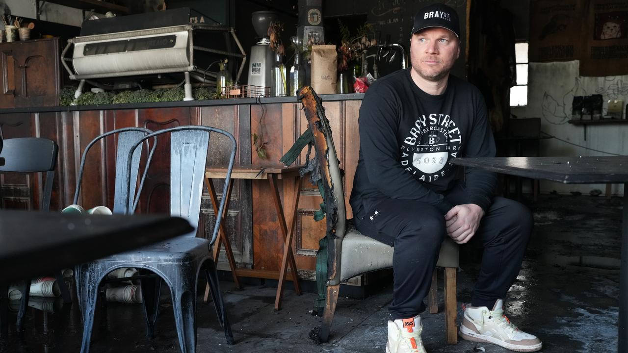 Devastated owner Dan Horrell inside his burnt-out Plympton Park business Bray St Coffee Roasters. Picture: Dean Martin