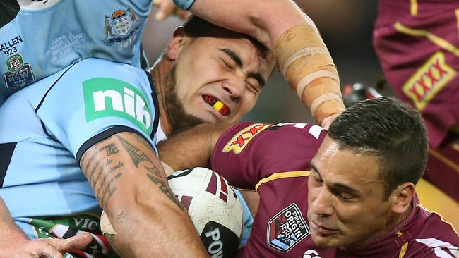 Andrew Fifita and Justin Hodges clash on the footy field. Now Fifita wants to get in the right against the Queenslander.