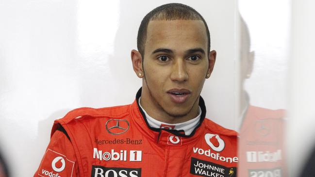 The first sign of bling ... double diamond stud earrings. Hamilton sporting a new look at the Chinese grand prix in April 2011. Photo: AP Photo/Andy Wong