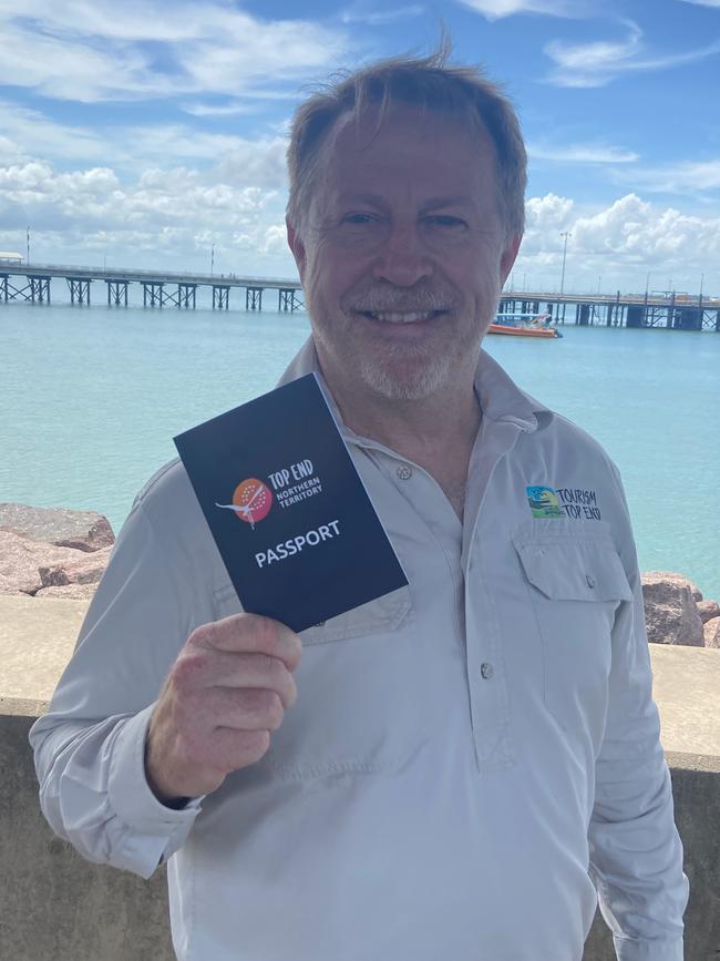 Tourism Top End's Glen Hingley with the Top End passport