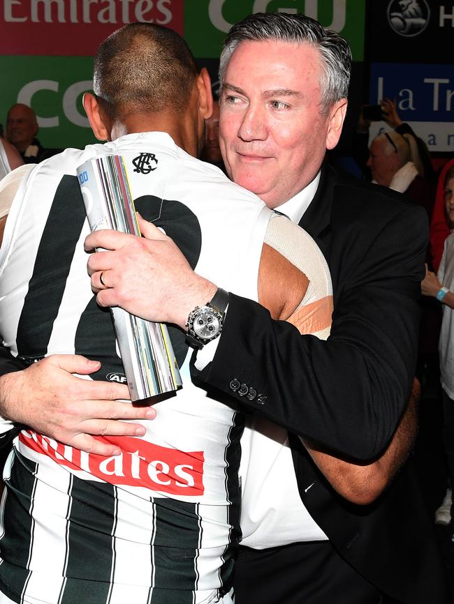 Eddie McGuire embraces Travis Varcoe after the win.