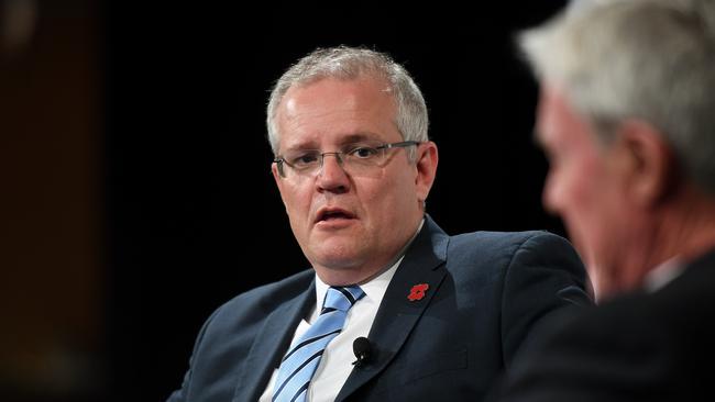 Prime Minister Scott Morrison looks on as Mike Munro hosts a Q&A at the Lifeline Australia Luncheon in Sydney, Friday, November 9, 2018. (AAP Image/Joel Carrett) NO ARCHIVING