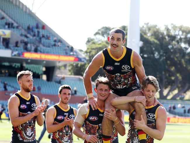 Taylor Walker is chaired off after his milestone game. Picture: Sarah Reed