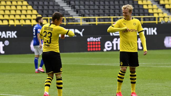 Some players, like Dortmund's Thorgan Hazard and Erling Haaland, celebrated within the rules. Picture: AP