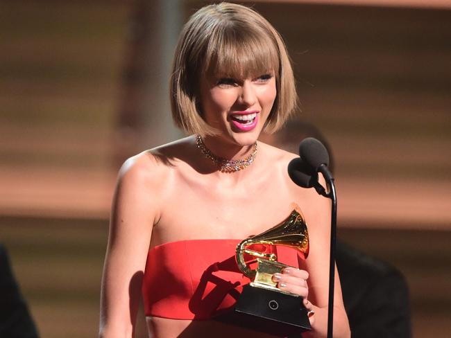 Well spoken ... Singer Taylor Swift accepts the award for the Album of the Year onstage during the 58th Annual Grammys.  Picture:  AFP