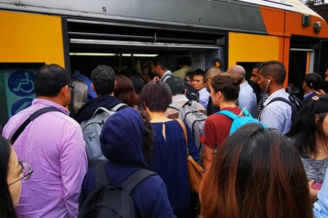 Commuters jostle for position on crammed trains at Epping on Monday. Picture: Supplied