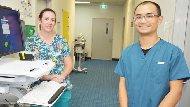 Logan Hospital COVID-19 Screening Clinic registered nurse Nellie Phillips and Dr John Wei.