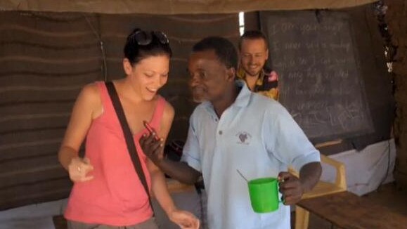 Moore pictured dancing with a refugee to Congolese music on <i>Go Back To Where You Came From</i>. Picture: SBS