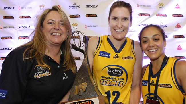 Flames coach Cheryl Chambers with captain Belinda Snell and MVP Leilani Mitchell after winning the WNBL crown.