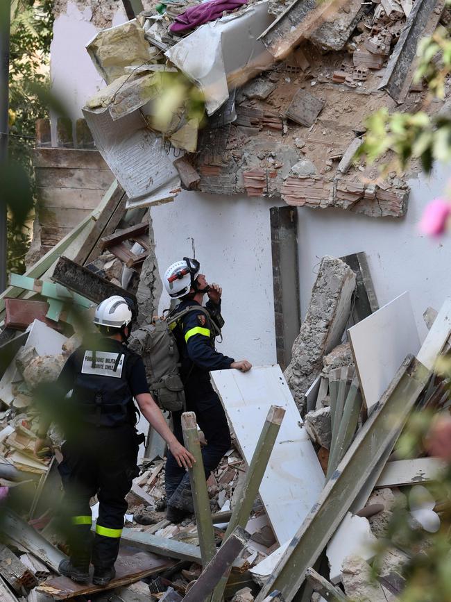 French rescue workers search for victims and survivors under the rubble of a building in the Gemayzeh neighbourhood in Beirut on August 6. Picture: AFP