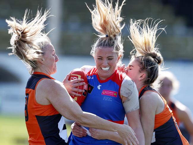 MELBOURNE . 29/08/2022. AFLW.  Round 1. Western Bulldogs vs GWS Giants at Ikon Park.   Gabby Newton of the Western Bulldogs  gets well tackled during the 1st qtr.   . Picture by Michael Klein