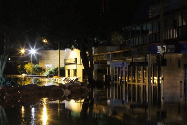 The levee at about 10:30 pm Monday night after suffering a breach. Photo: Robyne Cuerel / Fraser Coast Chronicle. Picture: Robyne Cuerel