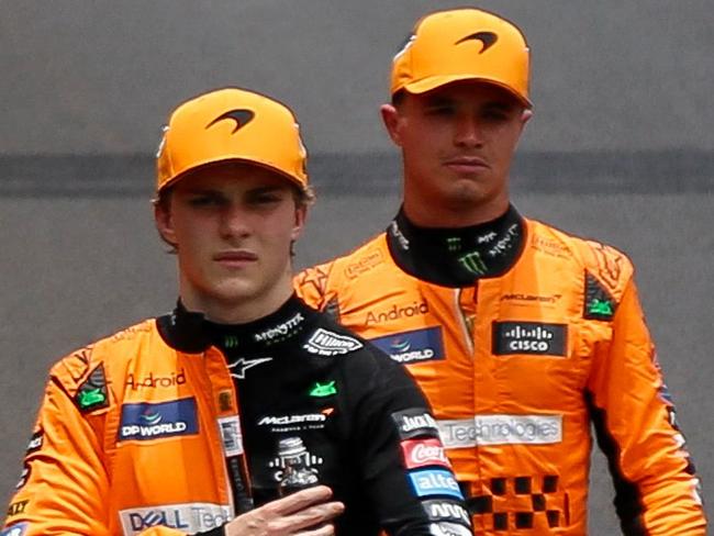 McLaren's Australian driver Oscar Piastri (L) and McLaren's British driver Lando Norris walk after the Sprint race at the Jose Carlos Pace racetrack, aka Interlagos, in Sao Paulo, Brazil, on November 2, 2024, on the eve of the Formula One Sao Paulo Grand Prix. (Photo by Miguel Schincariol / AFP)