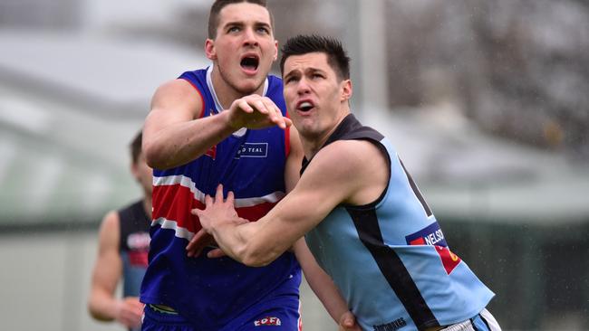 Keilor's Brock McGreggor and Aberfeldie's Joel Madden do battle in the ruck. Picture: Jamie Morey