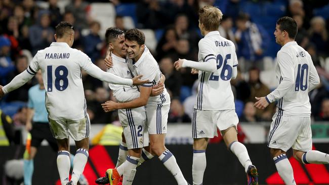 Real Madrid's Enzo Zidane, centre, celebrates after scoring a goal during a Spain's King's Cup soccer match against Cultural Leonesa.s