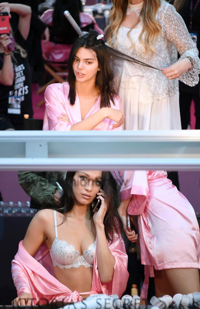 Kendall Jenner and Bella Hadid get ready backstage prior to the Victoria’s Secret Fashion Show on November 30, 2016 in Paris, France. Picture: AFP