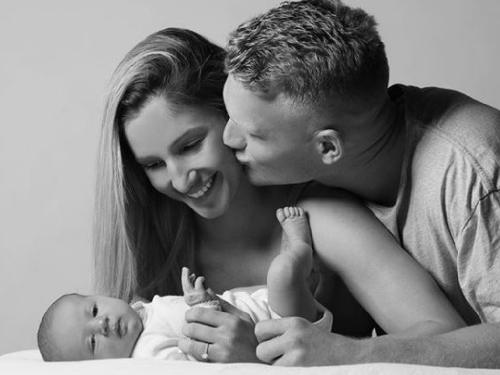 Adam Treloar with fiancee Kim and daughter Georgie. Source: Instagram