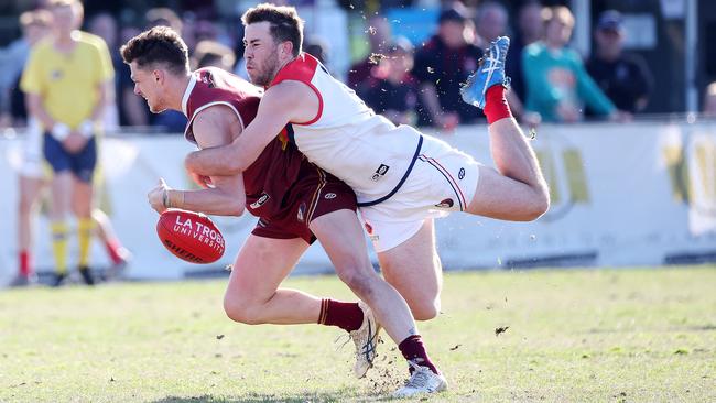 NFL: Ben Paterson of Lower Plenty is tackled by Diamond Creek’s Sam Gleeson. Picture: George Sal