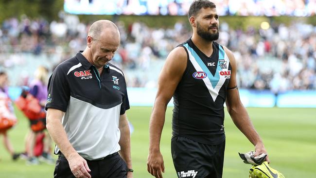 Ken Hinkley walks off Adelaide Oval with Paddy Ryder. Picture: Sarah Reed