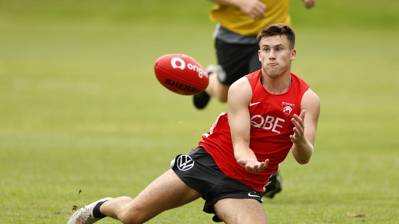 Jacob Konstanty marks at Swans training.