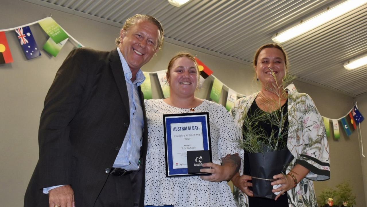 Young Arakwal woman Nickolla Clarke was named the Byron Shire's Creative Artist of the Year. She received her award from Australian Day Ambassador Brad Farmer (left) and Byron Shire councillor Sarah Ndiaye (right).