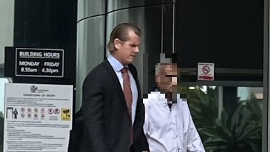 The man (right) leaving the Southport courthouse beside lawyer Joshua Boorman. Picture: Jessica Paul