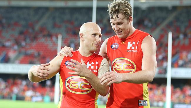 Former Gold Coast captain Gary Ablett and successor Tom Lynch.