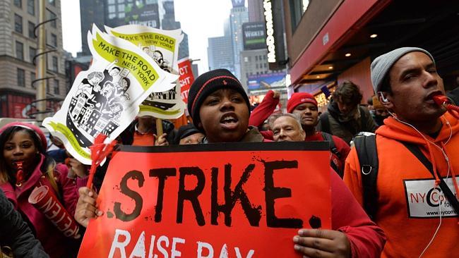 Demonstrators outside a McDonald's restaurant near New York's Times Square Picture: AFP. 