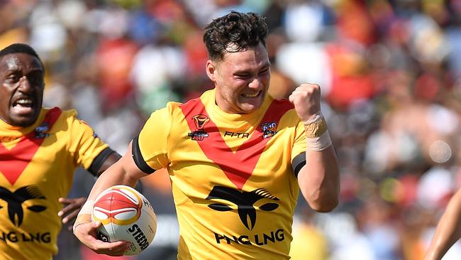 Lachlan Lam celebrates as he goes on to score a try during the 2017 Rugby League World Cup match between Papua New Guinea and the United States.