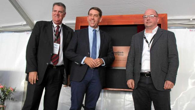 Dr Robert van Barneveld, The Honourable Cameron Dick and The Honourbable Mark Furner unveiling the golden plaque at the official opening. Picture: Laura Blackmore