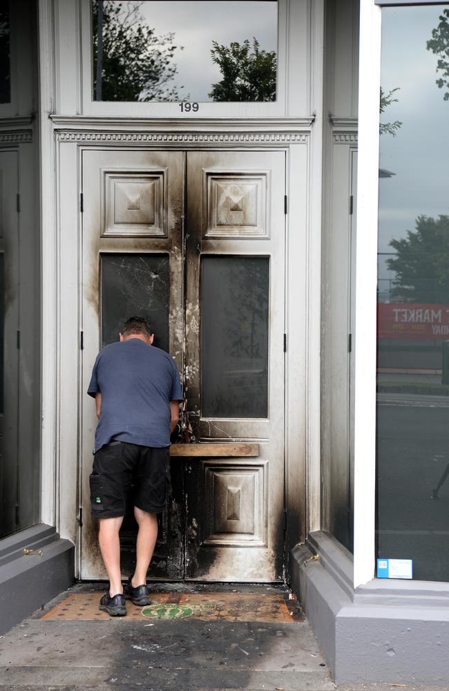 The blackened door after a molotov cocktail was thrown overnight. Picture: Andrew Henshaw