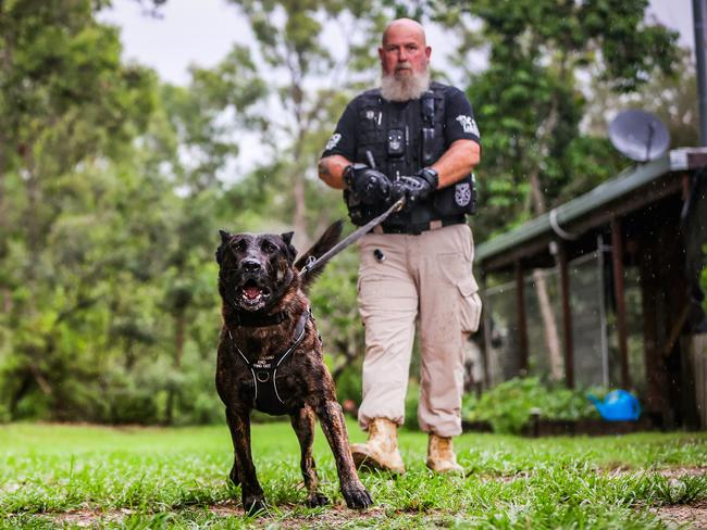 Dan Walker with his Dutch Shepherd Xee who is a security guard for Chelmer, Sherwood and Graceville. Picture: Nigel Hallett